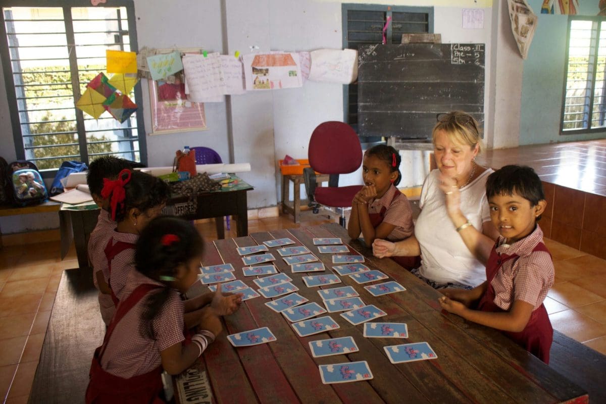 Mature volunteer teaching in India