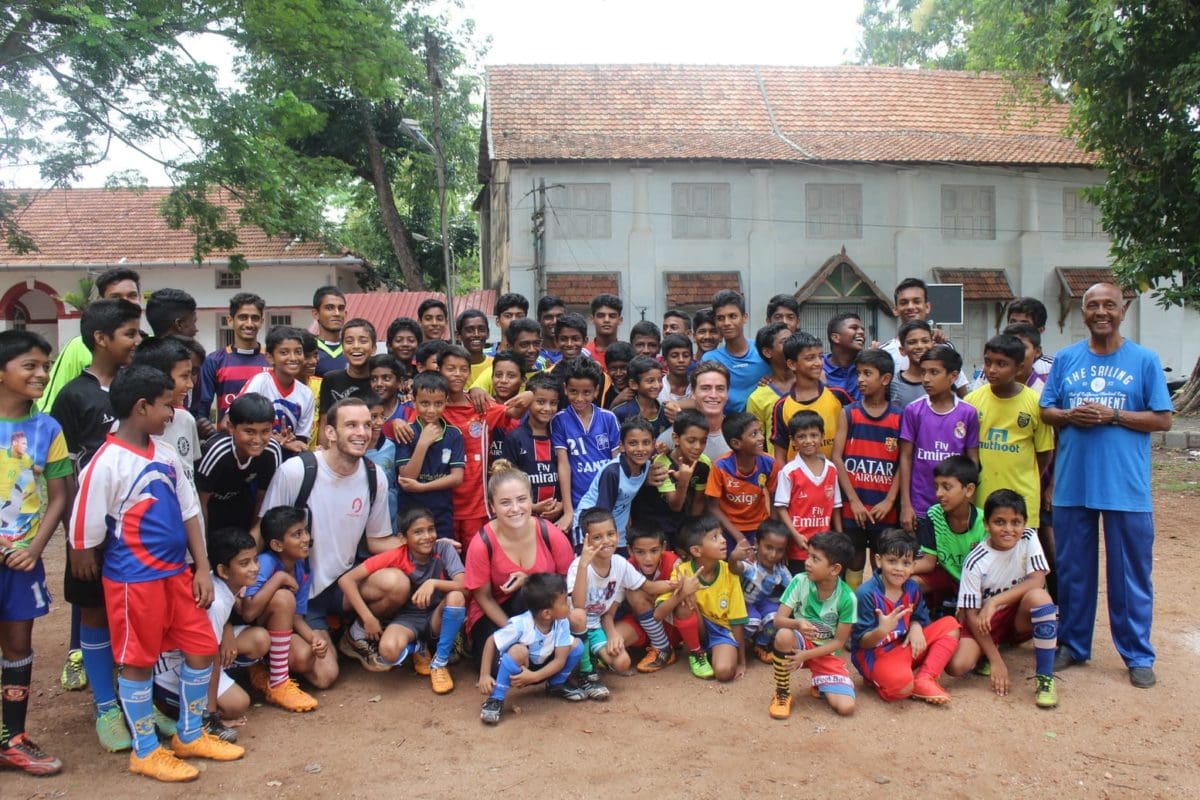 Volunteers and children after a football game