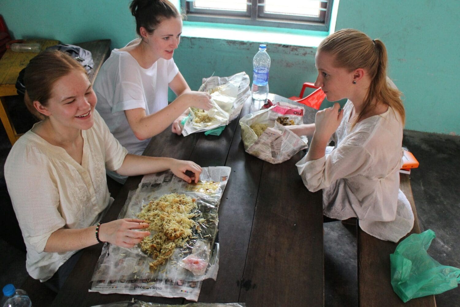 Volunteers in India enjoying a meal together