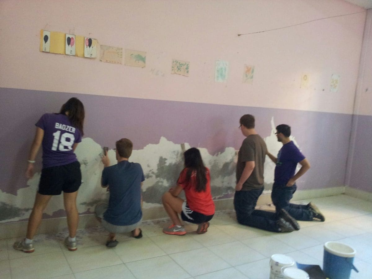 Volunteers painting classrooms