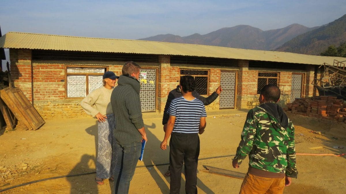 Volunteer in Nepal doing construction work meetings with locals
