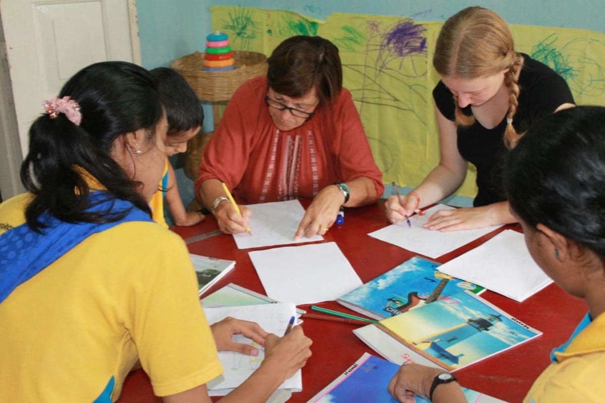 Volunteers in Sri Lanka preparing teaching materials